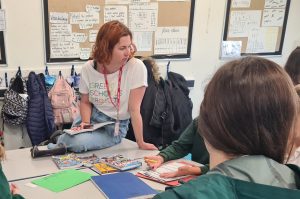 Community Climate Action Manager, Loz Hennessy, chats with students in a classroom in Bristol.